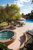 Seasonal outdoor pool, open 9:00 AM to 10:00 PM, pool umbrellas