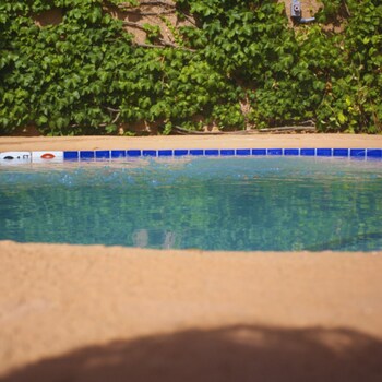 Seasonal outdoor pool, open 9:00 AM to 10:00 PM, pool umbrellas at The Lodge at Santa Fe