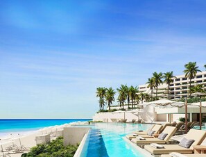 On the beach, white sand, free beach cabanas, sun loungers
