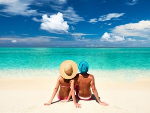On the beach, white sand, free beach cabanas, sun loungers