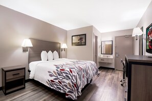 Deluxe Room, 1 Queen Bed (Upper Floor, Smaller, Smoke Free) | Pillowtop beds, desk, blackout drapes, iron/ironing board