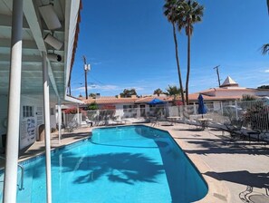 Outdoor pool, open 7:00 AM to 10:00 PM, pool umbrellas