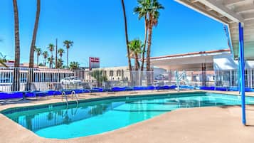 Outdoor pool, open 7:00 AM to 10:00 PM, pool umbrellas