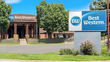 Welcome to the Best Western hotel, featuring a traditional brick facade and large windows.