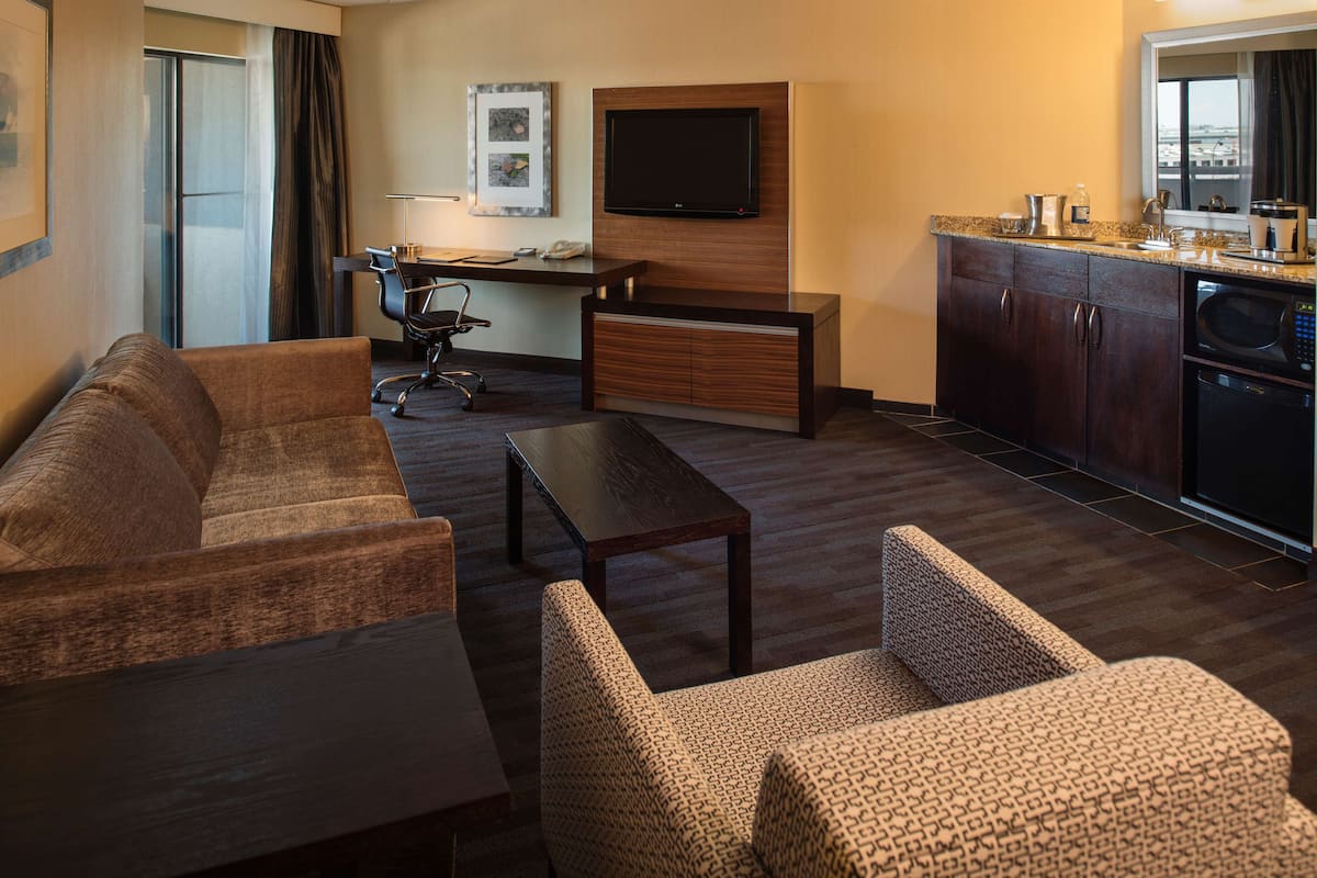Down comforters, pillowtop beds, in-room safe, desk
