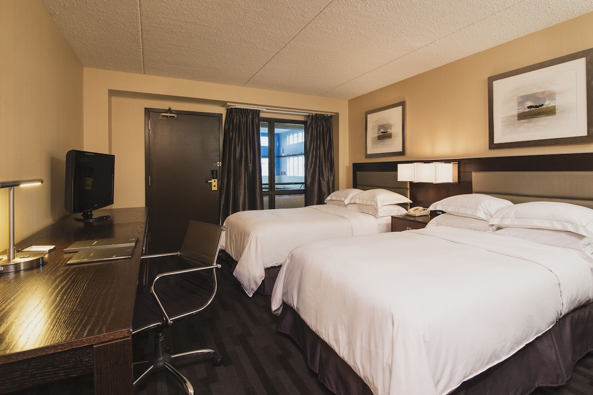 Down comforters, pillowtop beds, in-room safe, desk