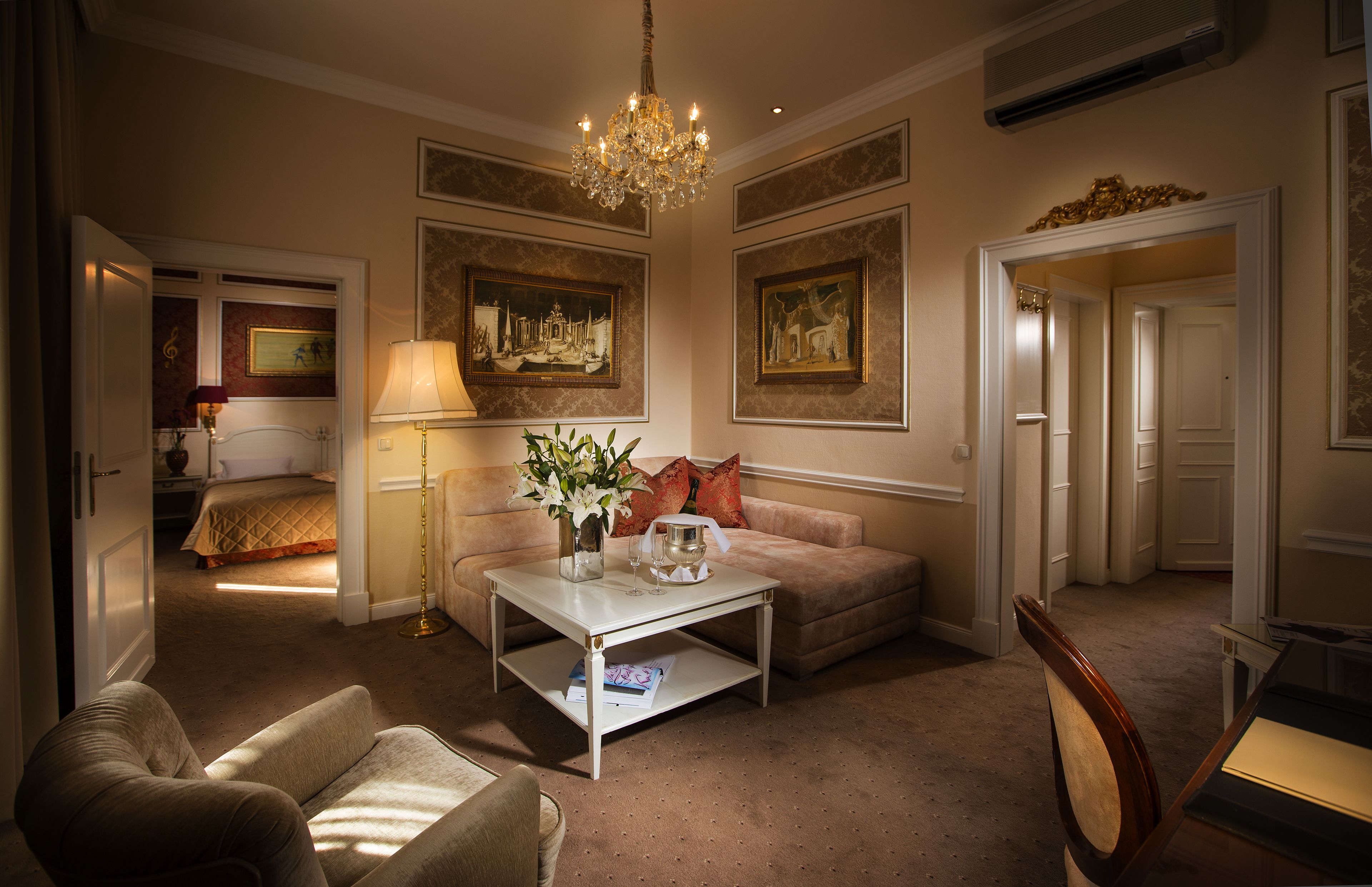 senior suite | living room | 18-inch flat-screen tv with satellite channels, tv, books