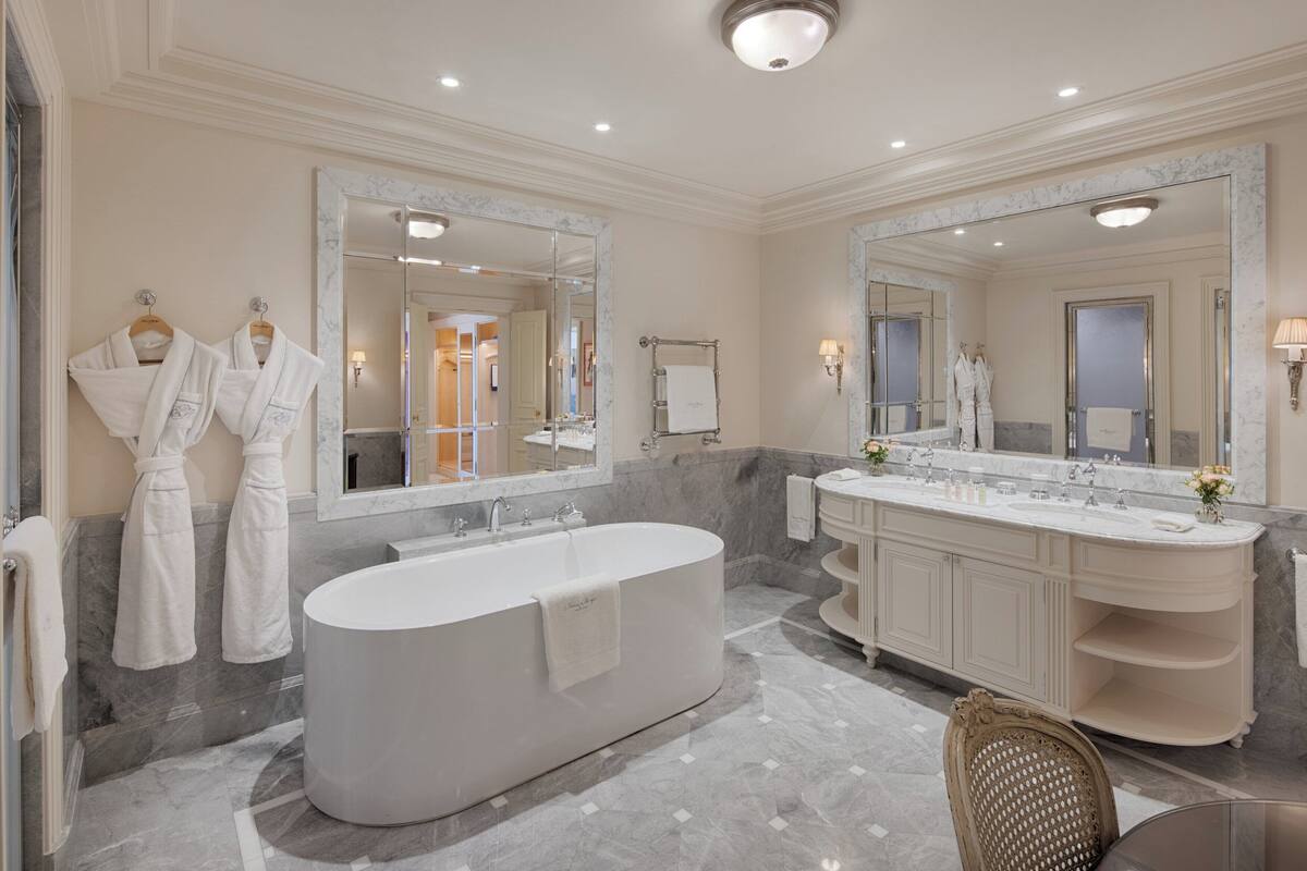 designer toiletries, hair dryer, bathrobes, slippers