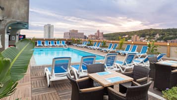 Seasonal outdoor pool, pool loungers