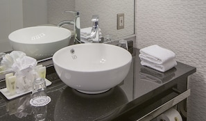 Combined shower/tub, designer toiletries, hair dryer, bathrobes