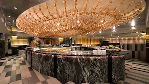 A luxurious hotel lobby with a marble reception desk, a checkered floor, and a unique ceiling design. - The Sherwood Taipei (Taipei)