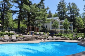 Seasonal outdoor pool, open 9:00 AM to 9:00 PM, pool umbrellas