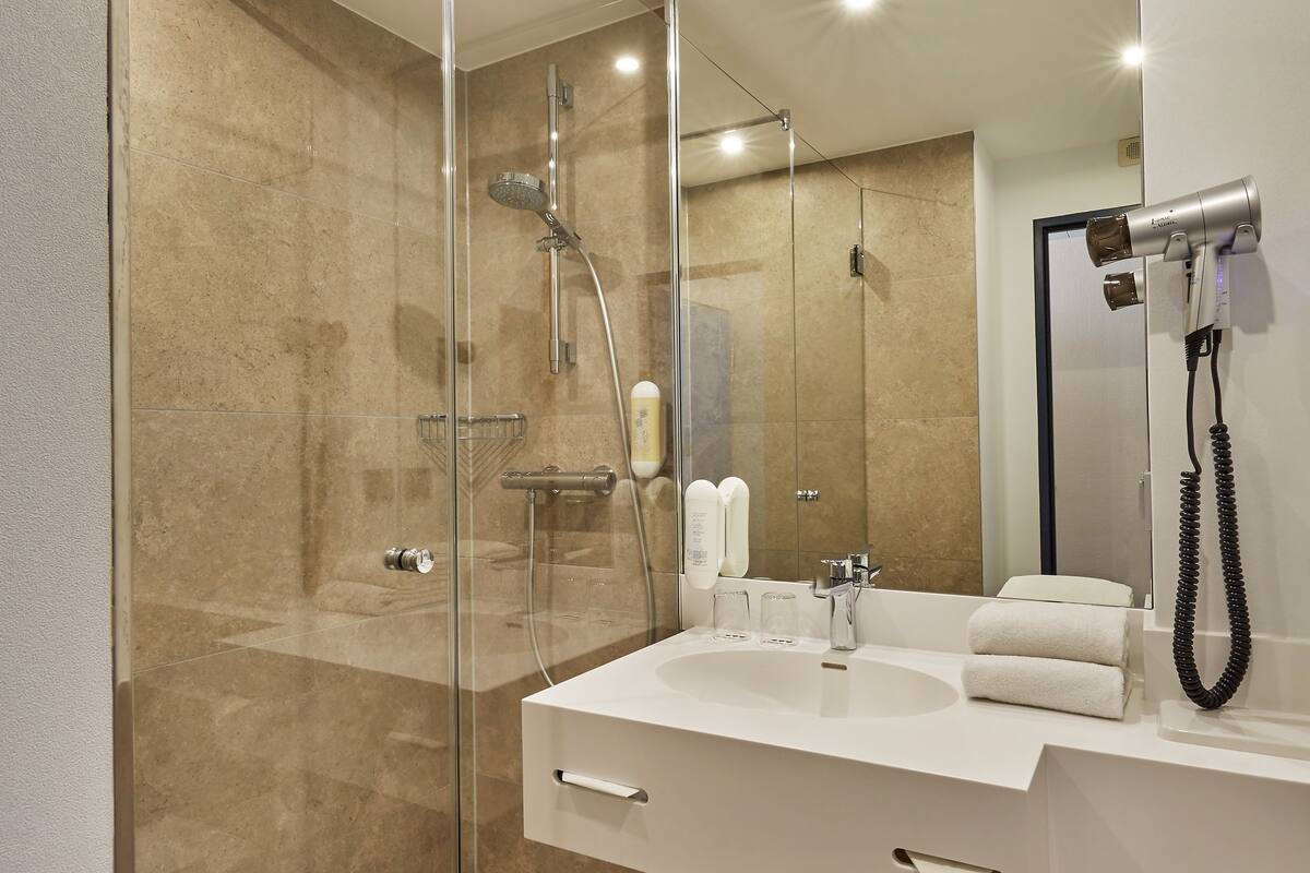 shower, eco-friendly toiletries, hair dryer, towels