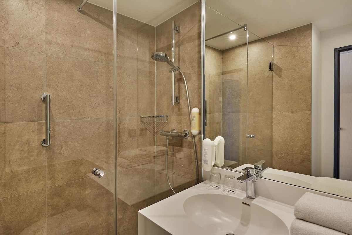 Shower, eco-friendly toiletries, hair dryer, towels
