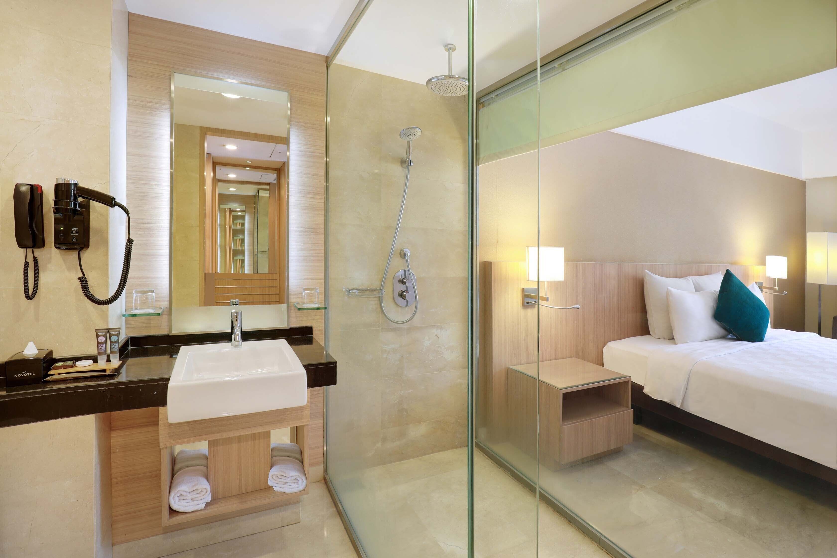 eco-friendly toiletries, hair dryer, slippers, towels