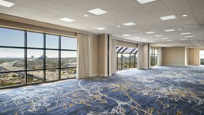 A large conference room with a high ceiling, large windows, and a patterned carpet. - The Westin San Antonio North (San Antonio)