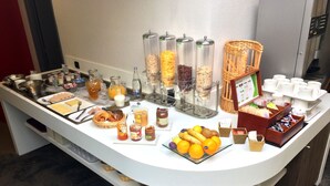 A breakfast buffet with various food items and condiments. - The Originals City, Ara Hôtel (Landerneau)