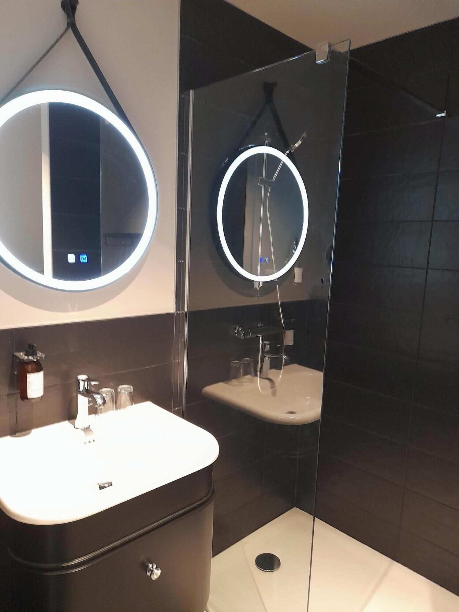 comfort studio, 1 queen bed, kitchenette, garden view | bathroom | eco-friendly toiletries, hair dryer, towels, soap