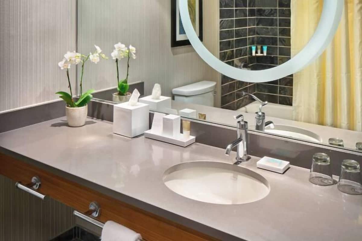 Combined shower/tub, designer toiletries, hair dryer, bathrobes