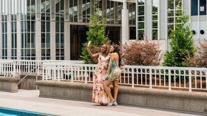 A modern building with large windows and a pool area. - Grand Hyatt Atlanta in Buckhead (Atlanta)