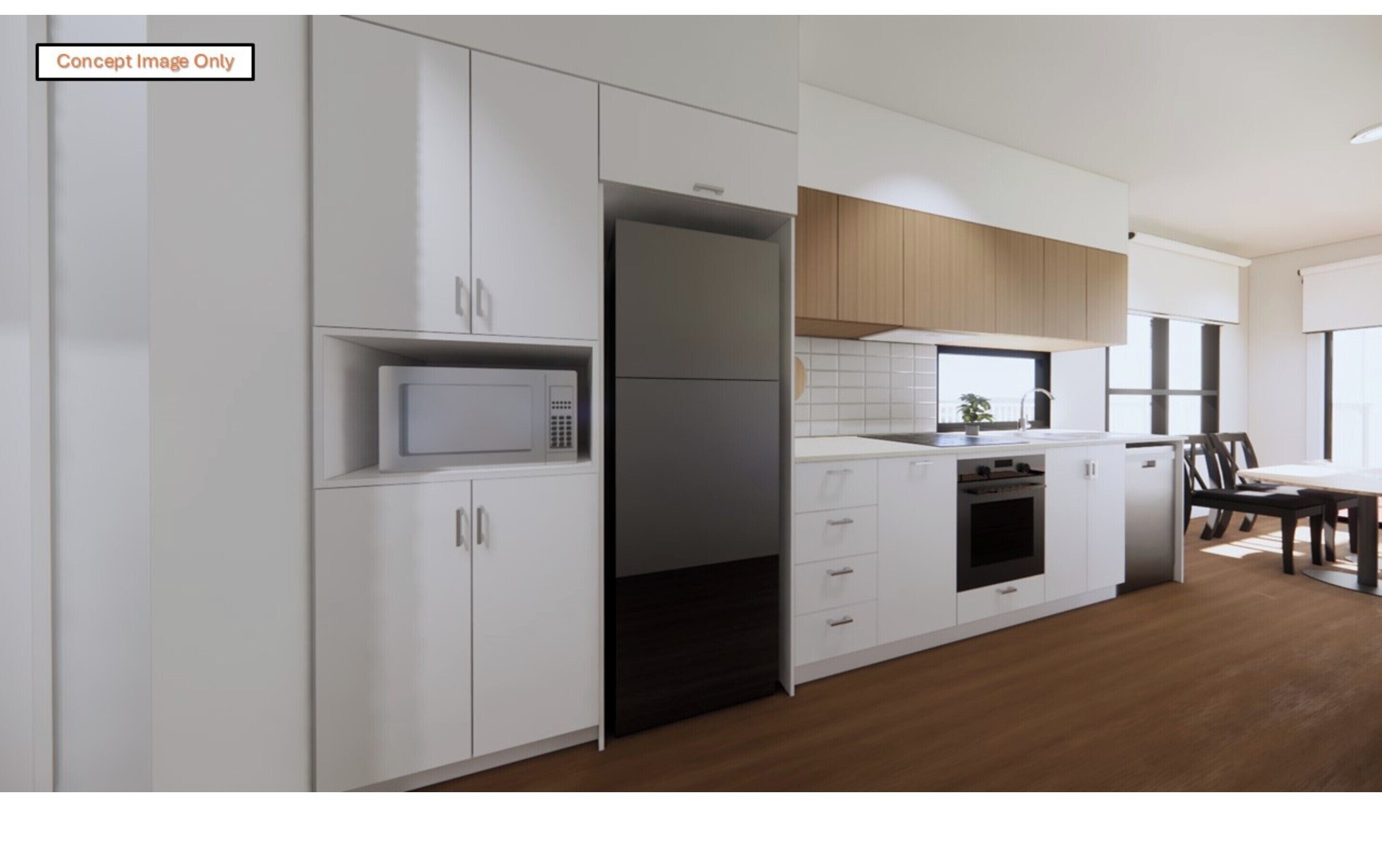 A modern kitchen with white cabinetry, a microwave, a built-in oven, and a dining area with a table and chairs.