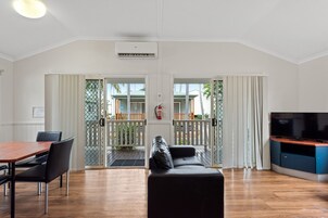 Deluxe 2 Bedroom Cabin | Living area | 32-inch flat-screen TV with cable channels, TV