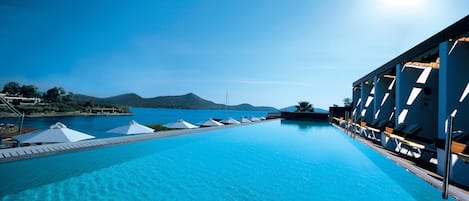 Indoor pool, seasonal outdoor pool, pool umbrellas, sun loungers
