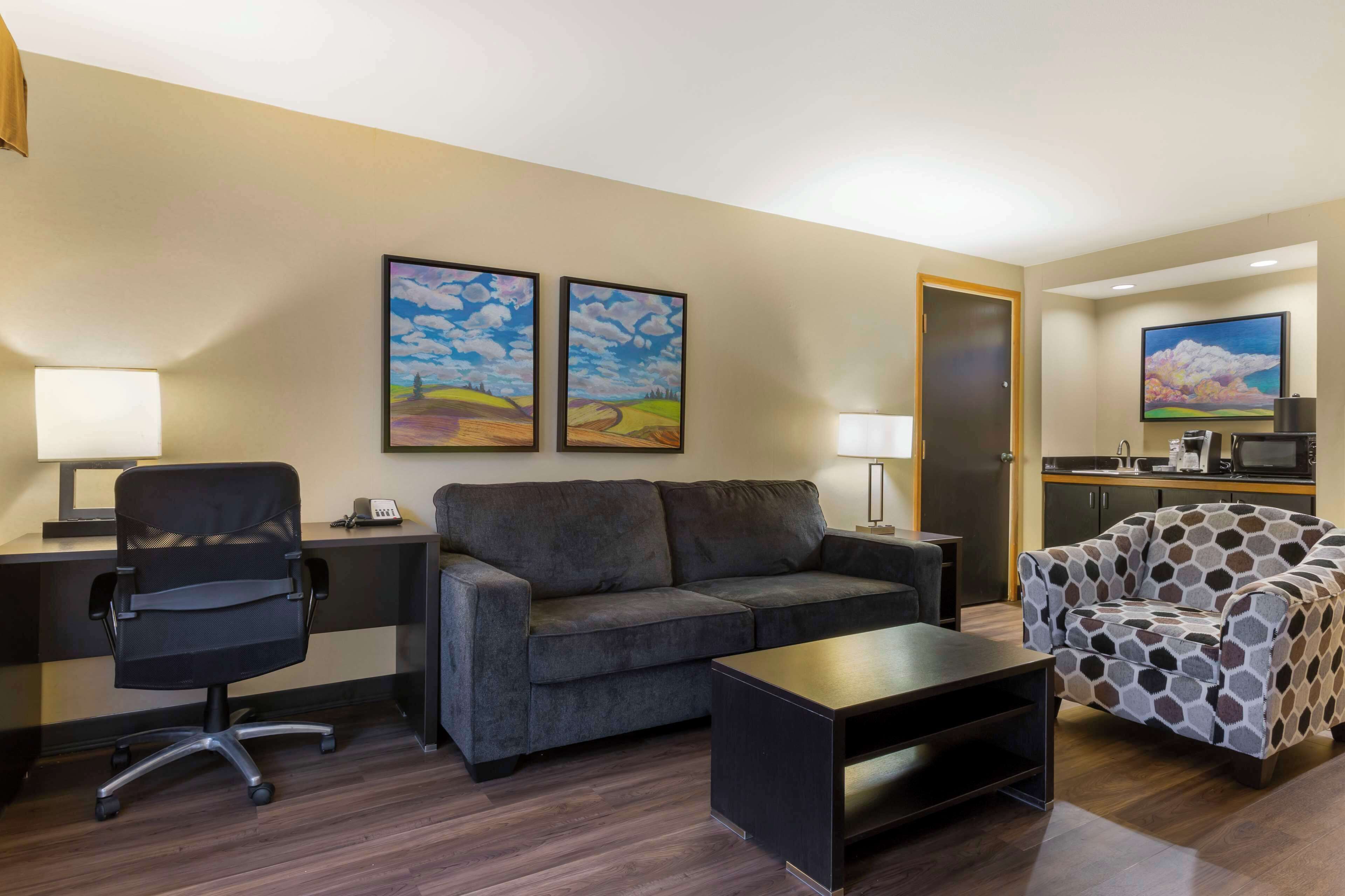 suite, 1 king bed, non smoking, poolside | desk, iron/ironing board, free cots/infant beds, bed sheets