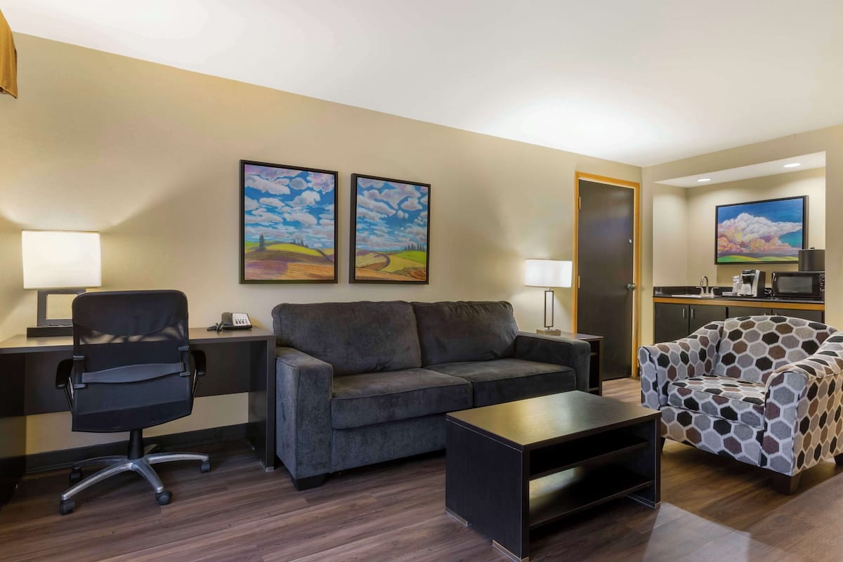 suite, 1 king bed, non smoking, poolside | desk, iron/ironing board, free cots/infant beds, bed sheets