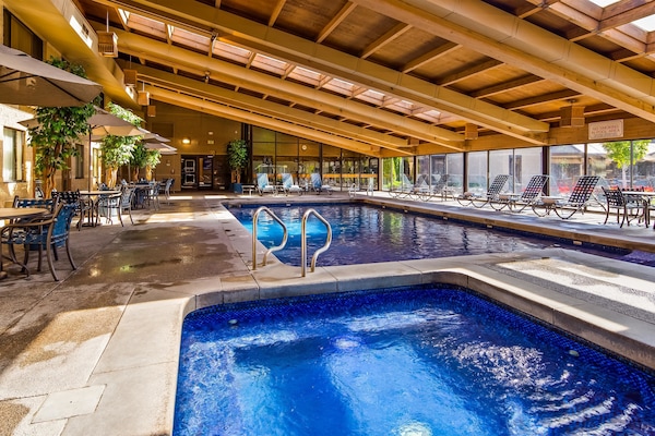 Indoor pool, open 8:00 AM to 10:00 PM, pool loungers