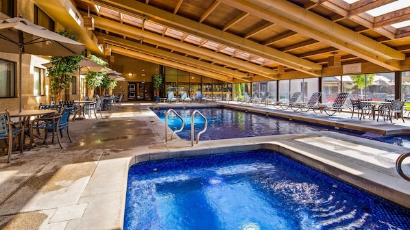 Indoor pool, open 8:00 AM to 10:00 PM, pool loungers