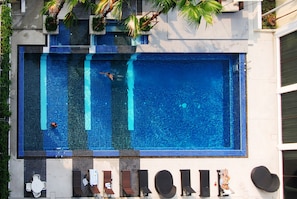 Outdoor pool, open 7:00 AM to 7:00 PM, free cabanas, pool umbrellas