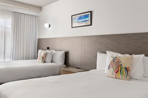 Premium bedding, desk, laptop workspace, blackout curtains