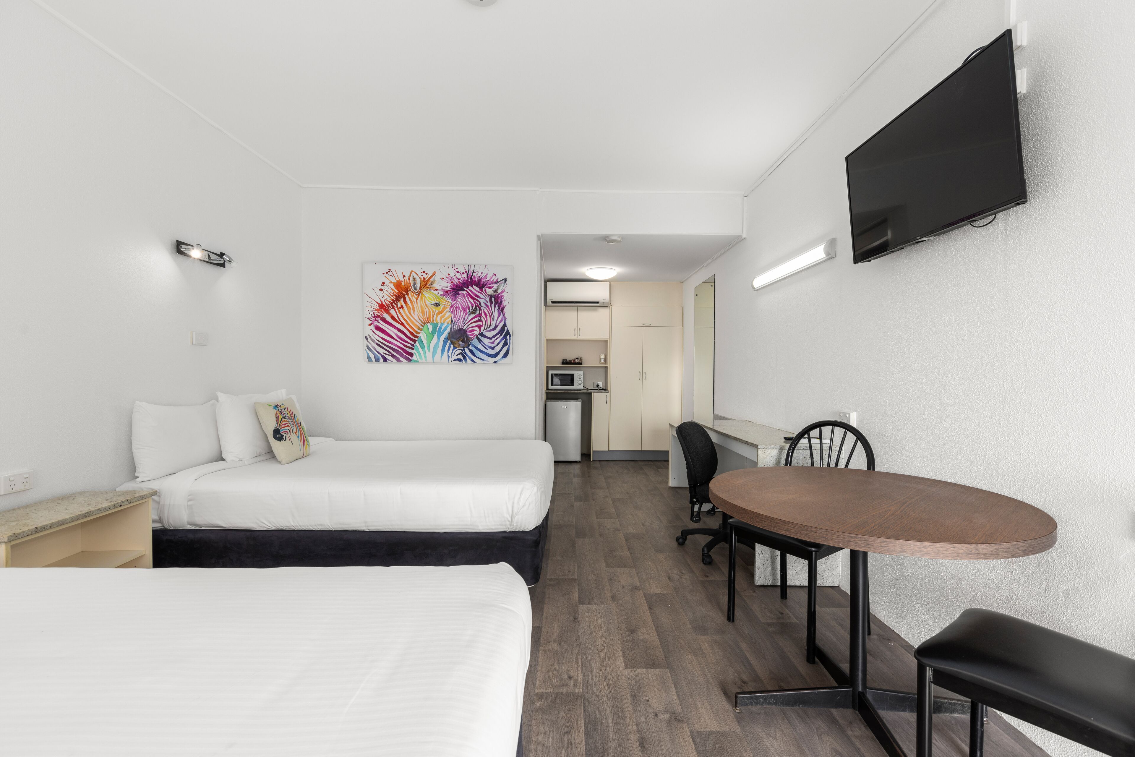 premium bedding, desk, laptop workspace, blackout curtains