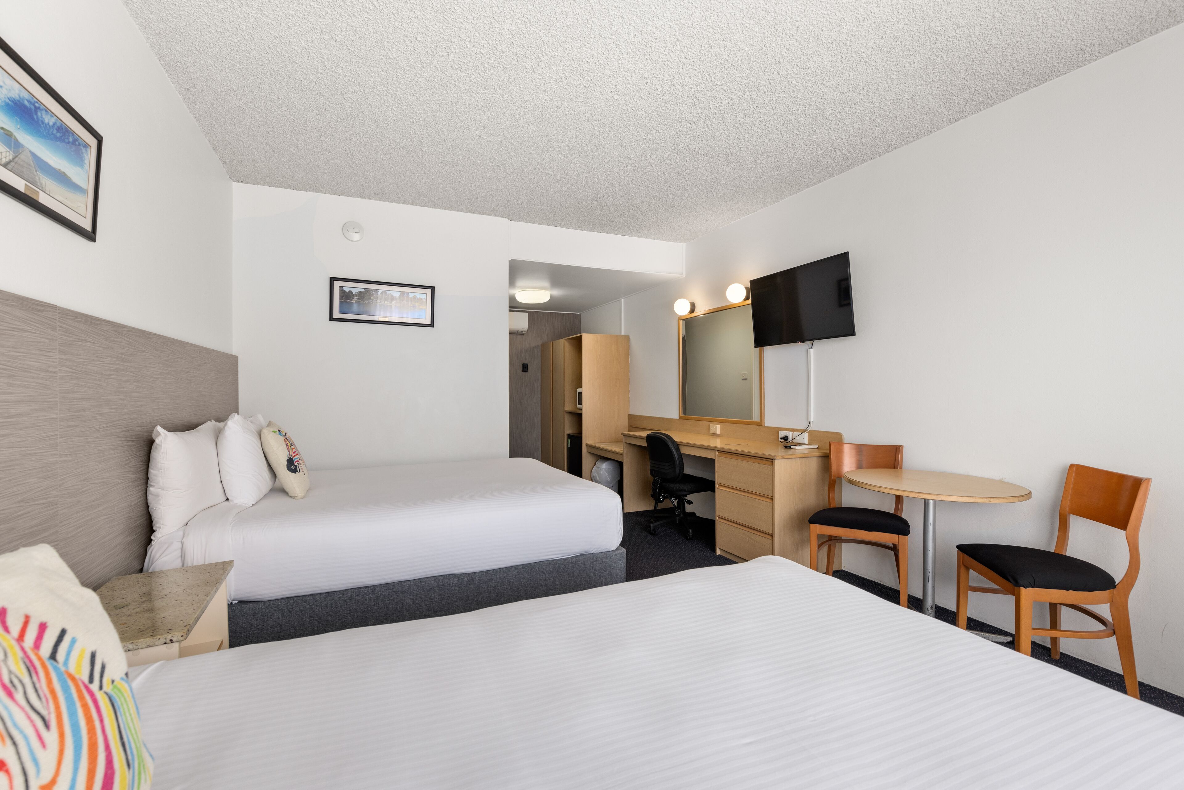 premium bedding, desk, laptop workspace, blackout curtains