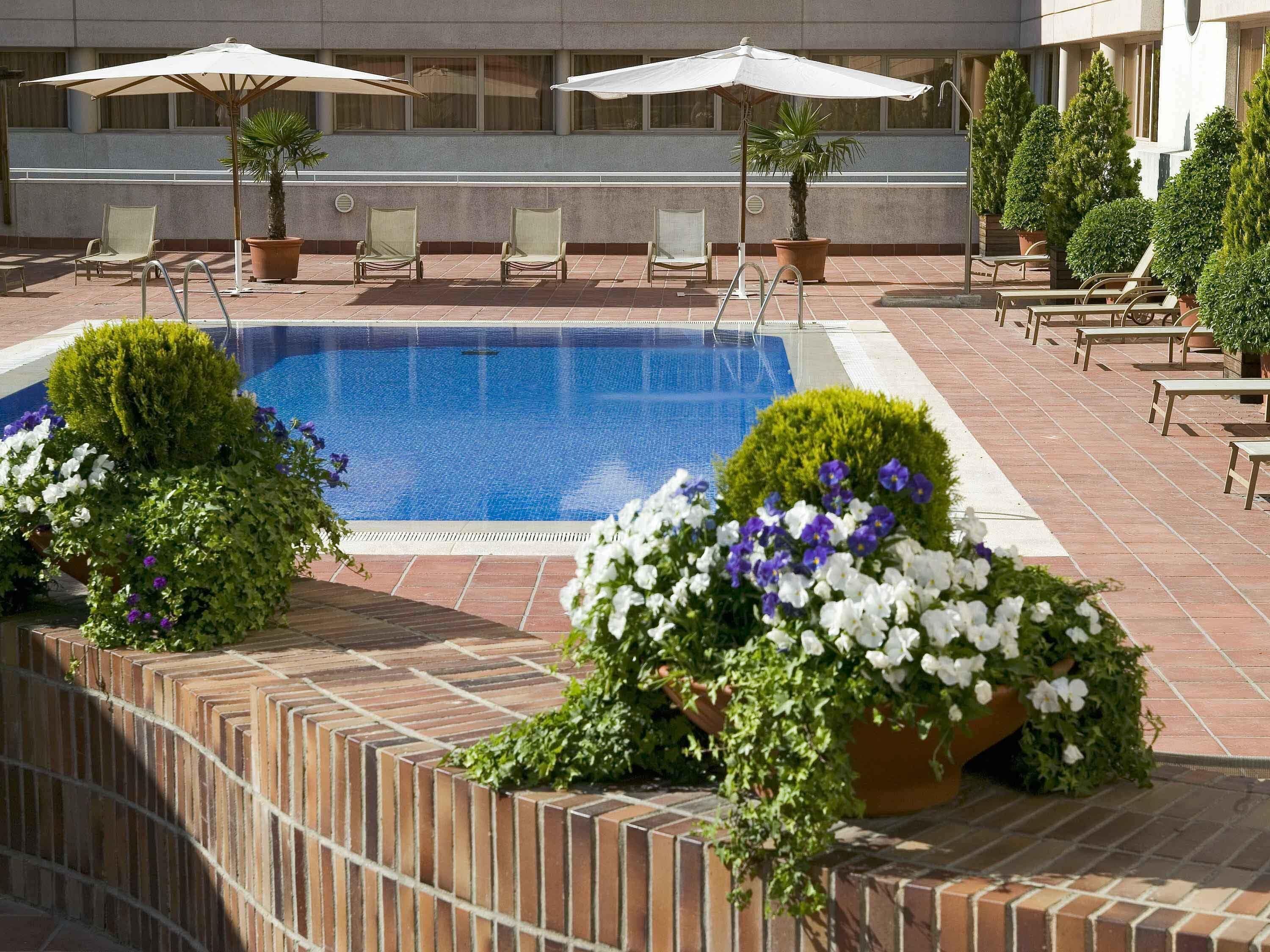 Seasonal outdoor pool, open noon to 9:00 PM, pool umbrellas