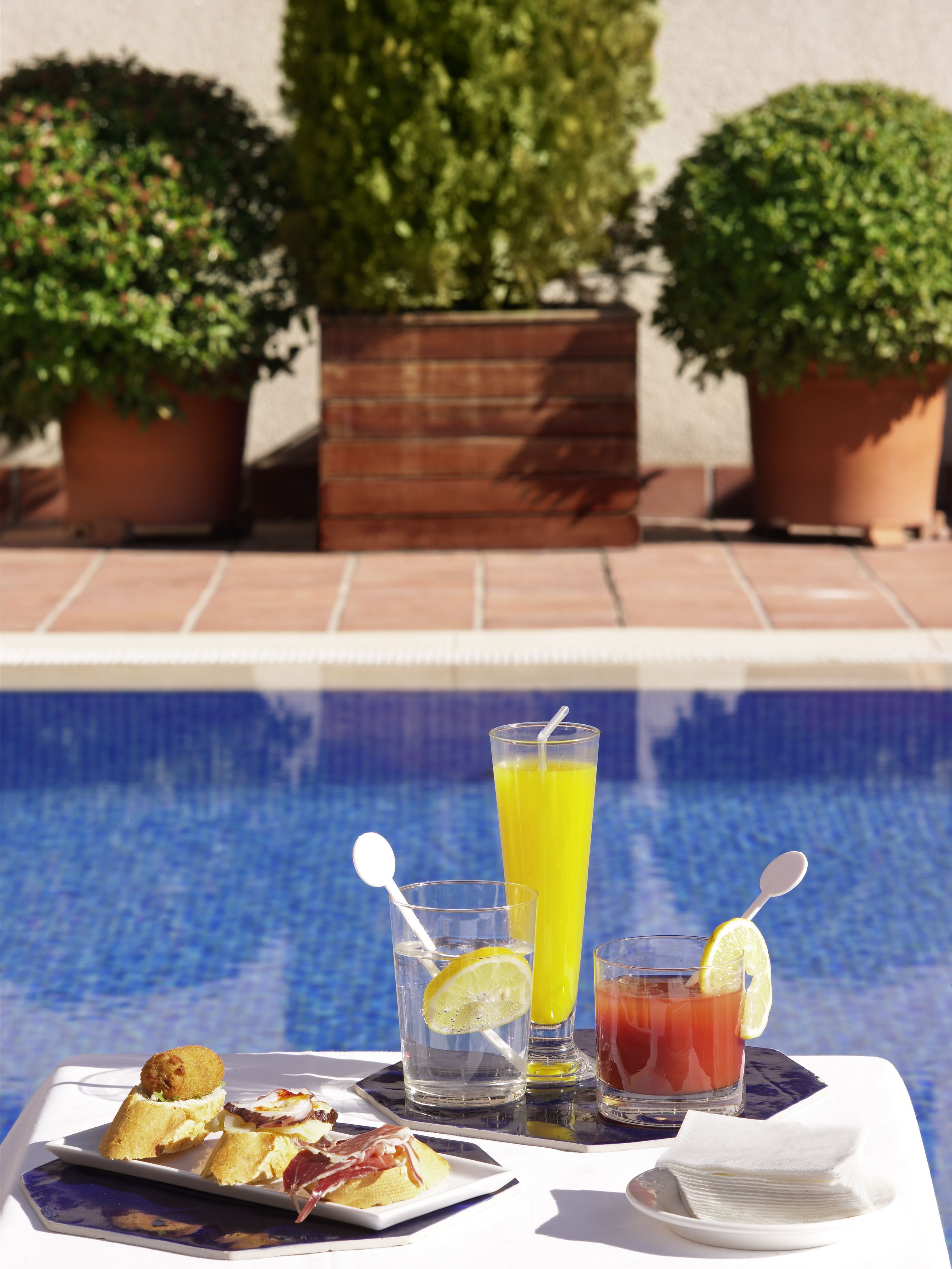 seasonal outdoor pool, open noon to 9:00 pm, pool umbrellas