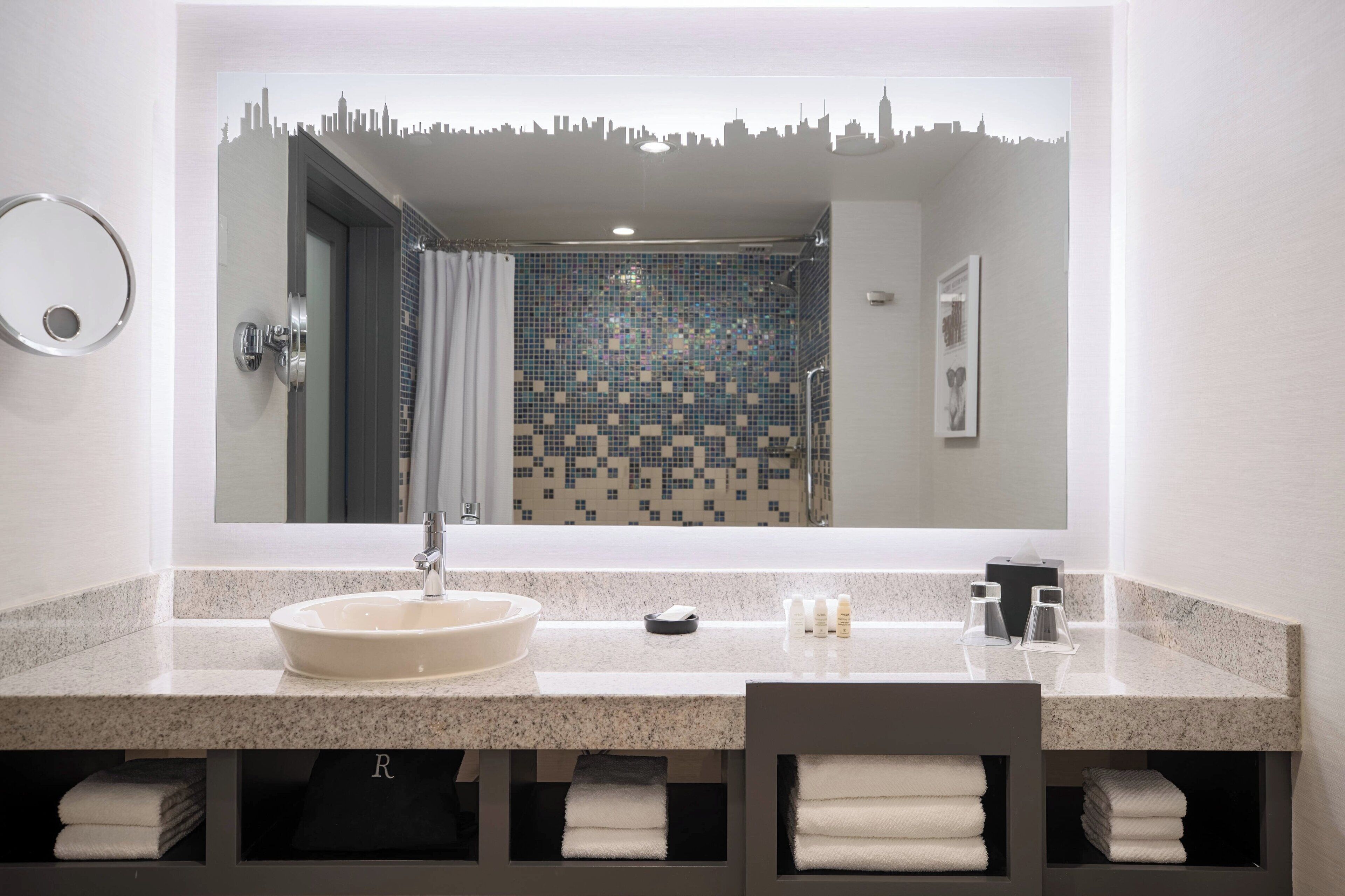 shower, designer toiletries, hair dryer, towels