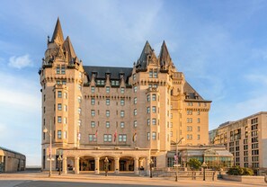 A large, historic building with multiple towers and a grand entrance. - Fairmont Chateau Laurier (Ottawa)
