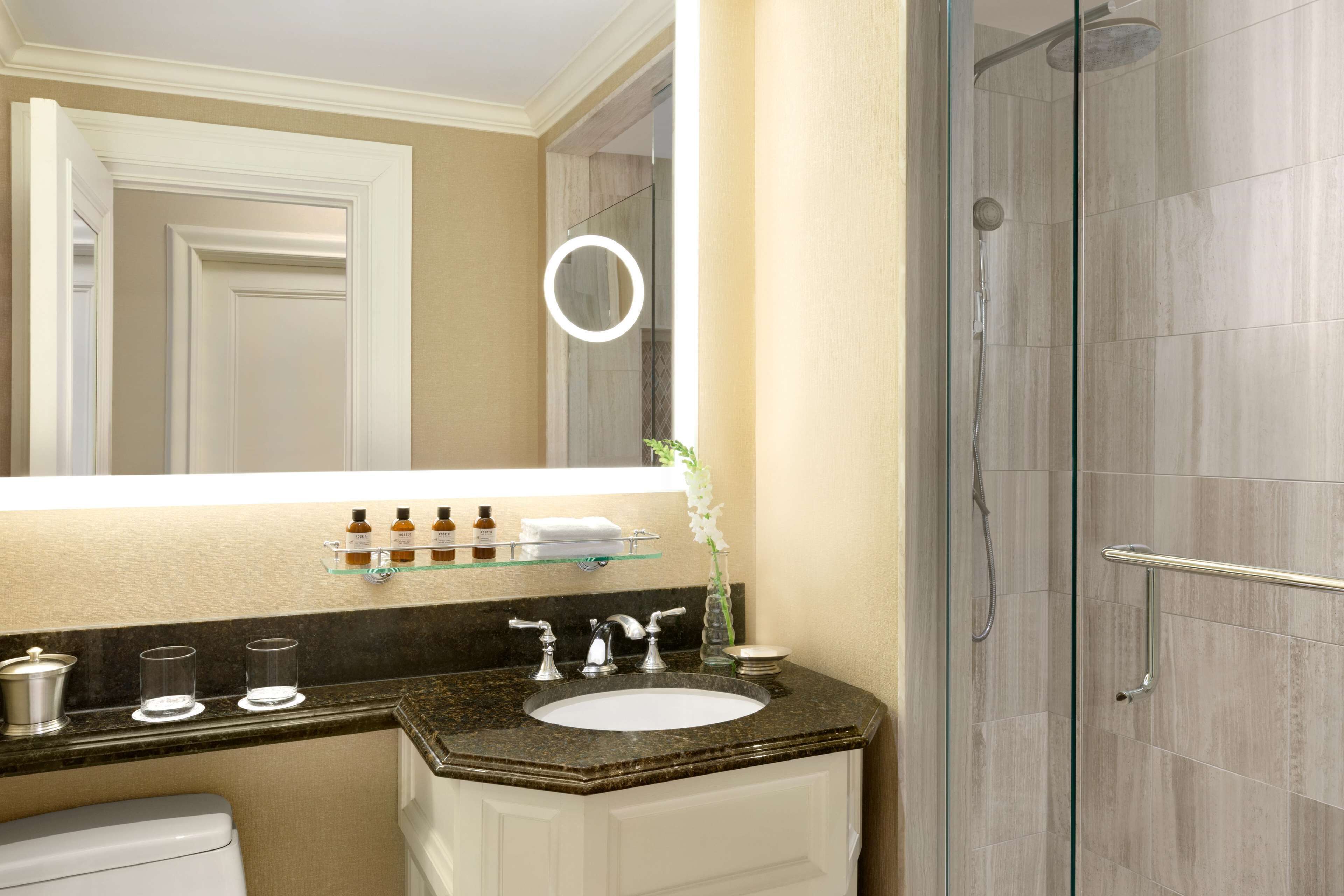 combined shower/bathtub, designer toiletries, hair dryer, bathrobes