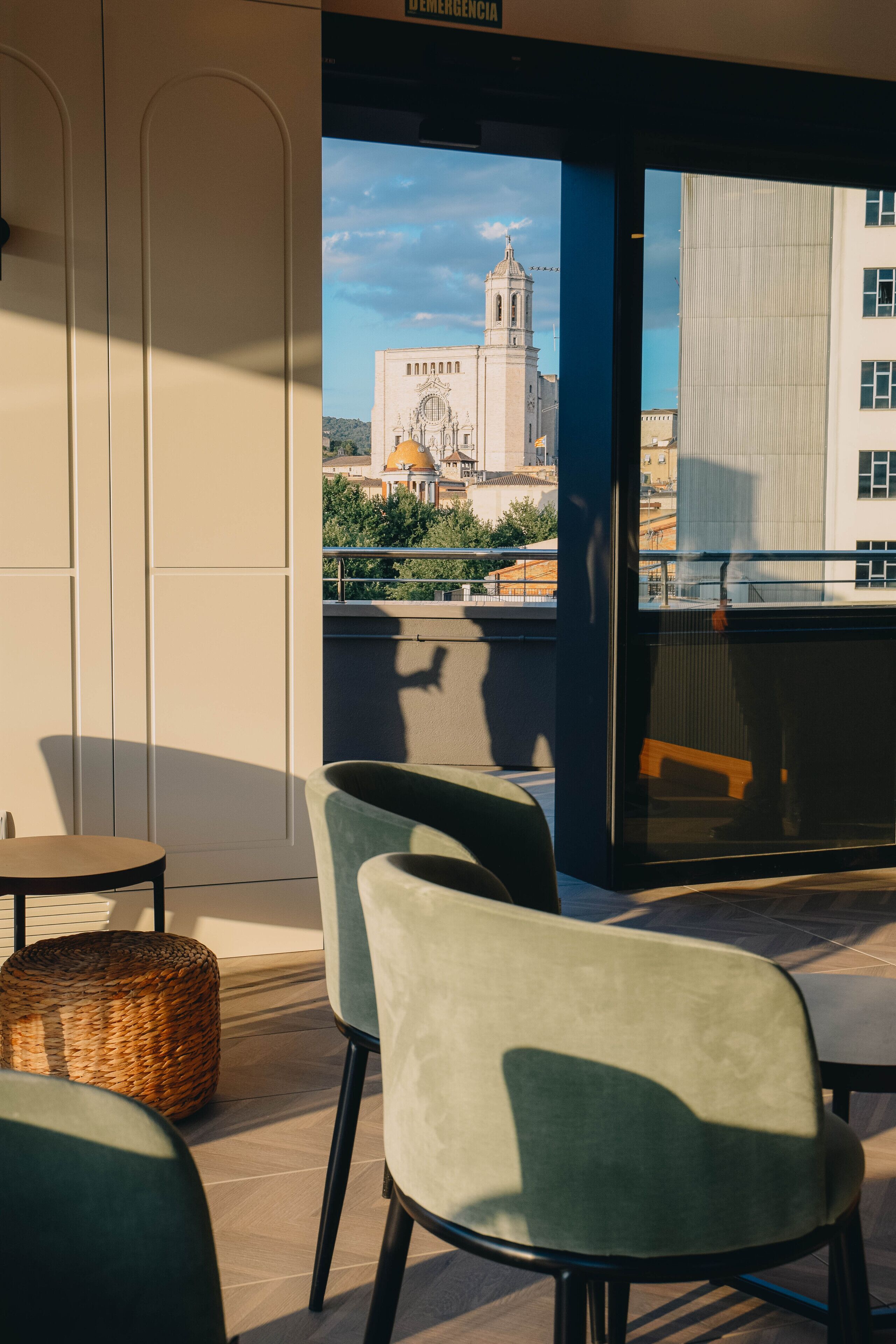 A modern interior with a view of a historic building.