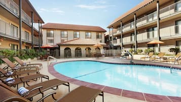 Outdoor pool, open 9:00 AM to 10:00 PM, pool loungers