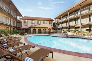 Outdoor pool, open 9:00 AM to 10:00 PM, sun loungers
