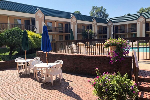 Seasonal outdoor pool, open 9:30 AM to 10 PM, pool umbrellas