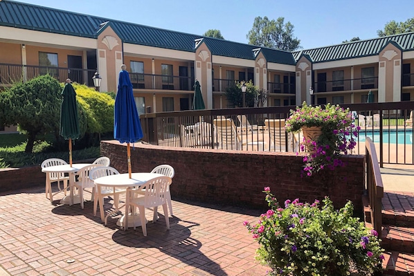 Seasonal outdoor pool, open 9:30 AM to 10 PM, pool umbrellas
