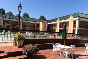 Seasonal outdoor pool, open 9:30 AM to 10 PM, pool umbrellas