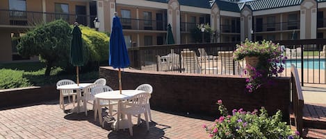 Seasonal outdoor pool, open 9:30 AM to 10 PM, pool umbrellas