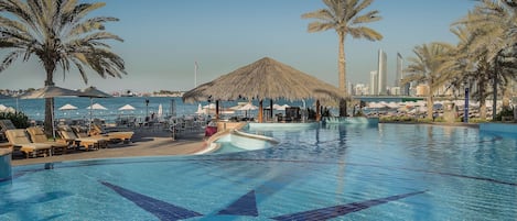 3 outdoor pools, open 8:00 AM to 7:00 PM, pool umbrellas, pool loungers