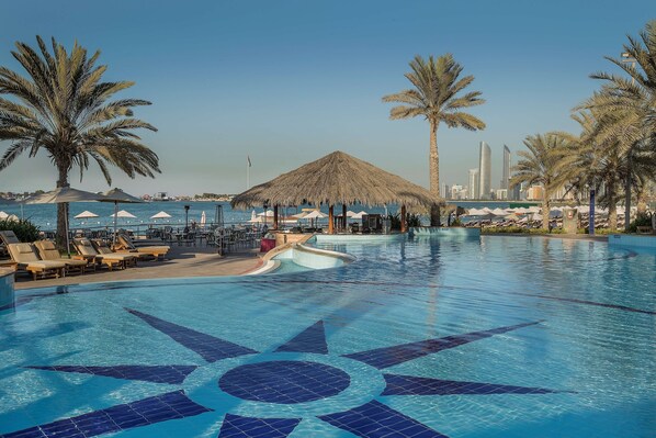 3 outdoor pools, open 8:00 AM to 7:00 PM, pool umbrellas, pool loungers