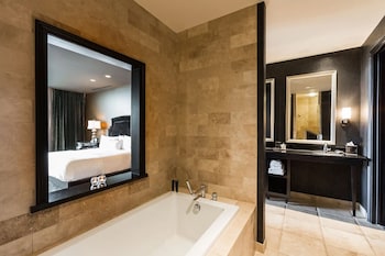 Hydromassage showerhead, designer toiletries, hair dryer, bathrobes at Hotel Zaza Houston Museum District